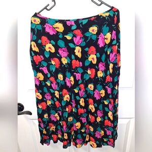 A Carole Little floral size 10 skirt with a 30.5" length. It has a side zipper.